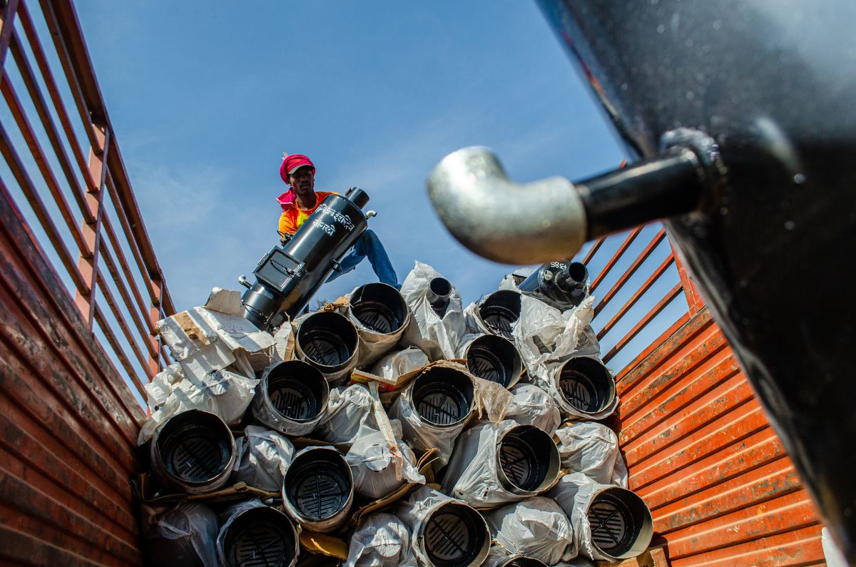 A truck full of water heaters is unloaded for distribution at a village in Bramhapuri, in Maharashtra’s Chandrapur district.